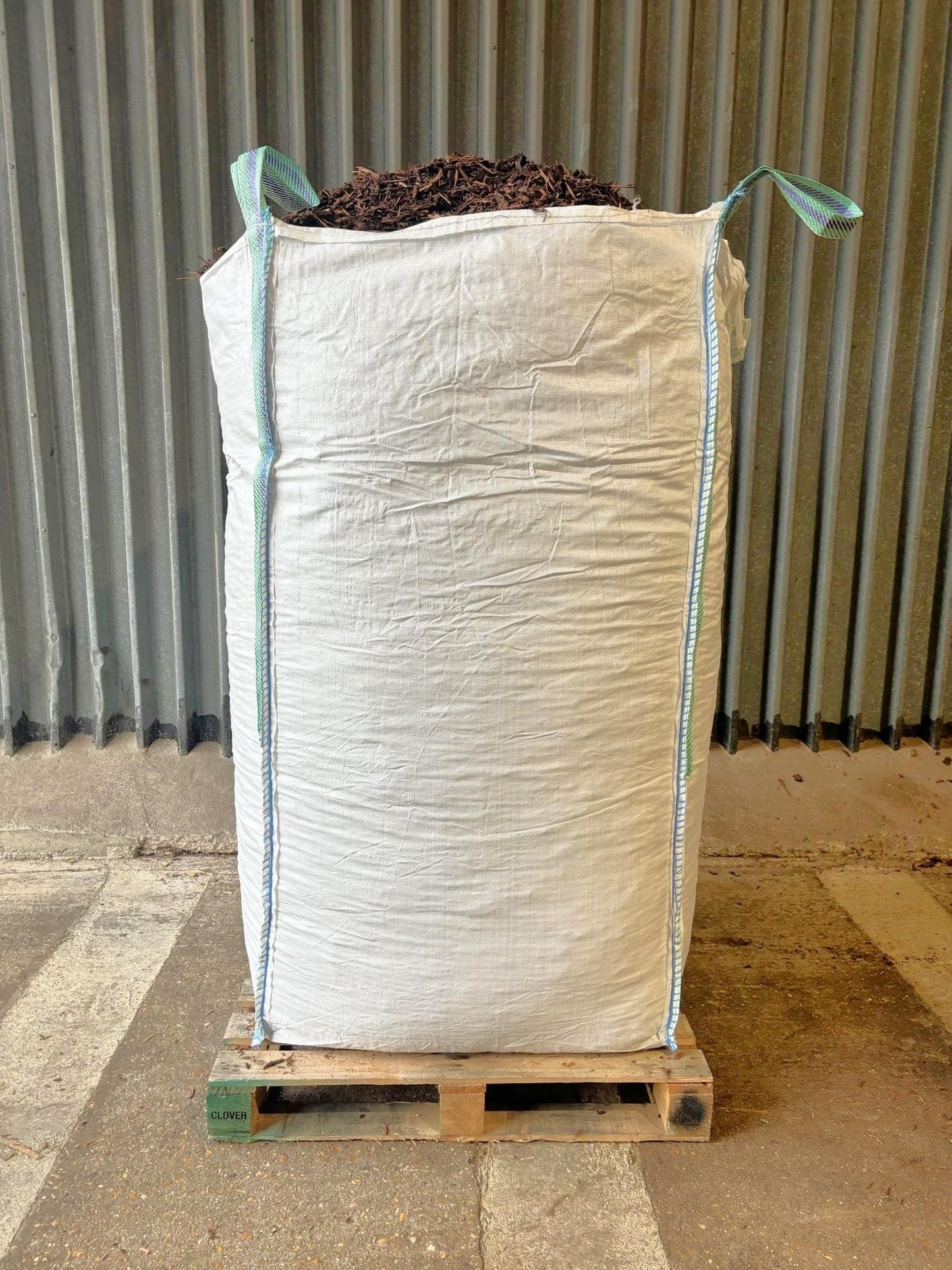 A large bulk bag filled with chicken run wood chips.