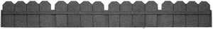 A section of a gray stone garden border with a scalloped top, typically used to edge flower beds or lawns.